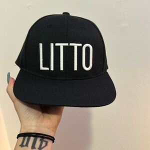 Black snap back. Brand new, never worn.